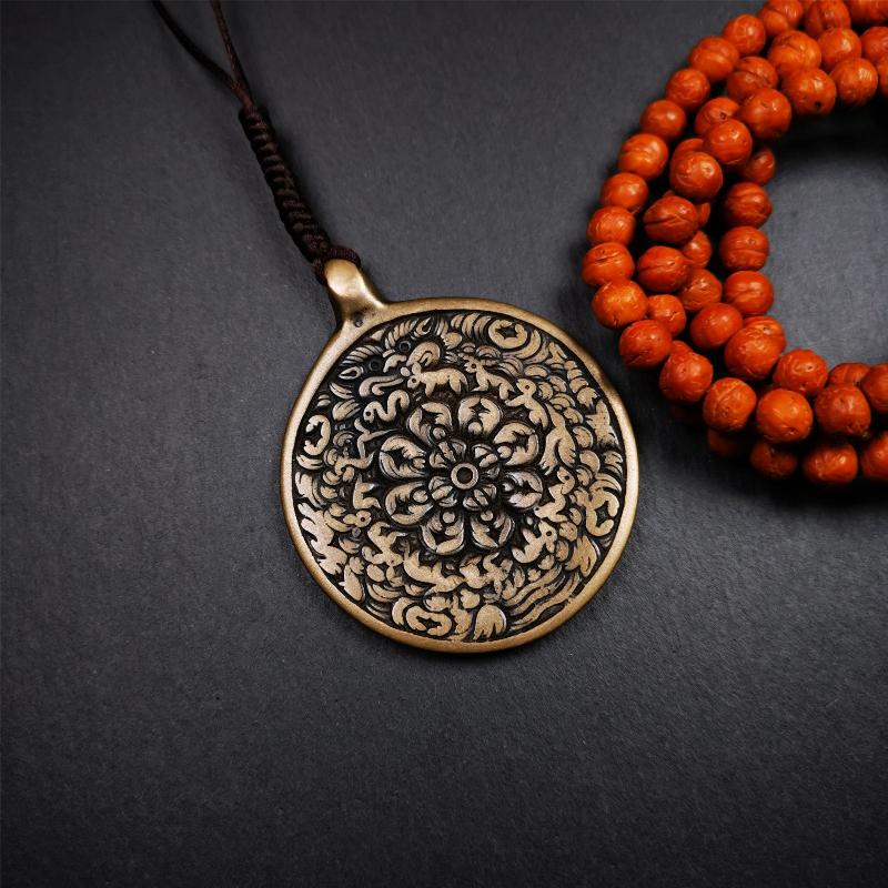 This unique meling amulet is handmade in Baiyu County Tibet,Where is the famous handicraft industry base in Tibetan areas. It is made of lima brass,2.16 inches diameter,the front center is a very rare mandala flower shape.
