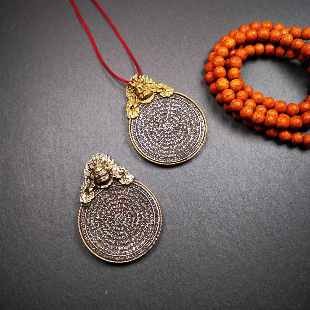 This type of tibetan mantra badge amulet was made by Tibetan craftsmen and come from Hepo Town, Baiyu County, Tibet.It is made of cold iron,grey color,carved mantra of Om Mani Padme Hum It adopts a split casting method, the shell is Mahakala.