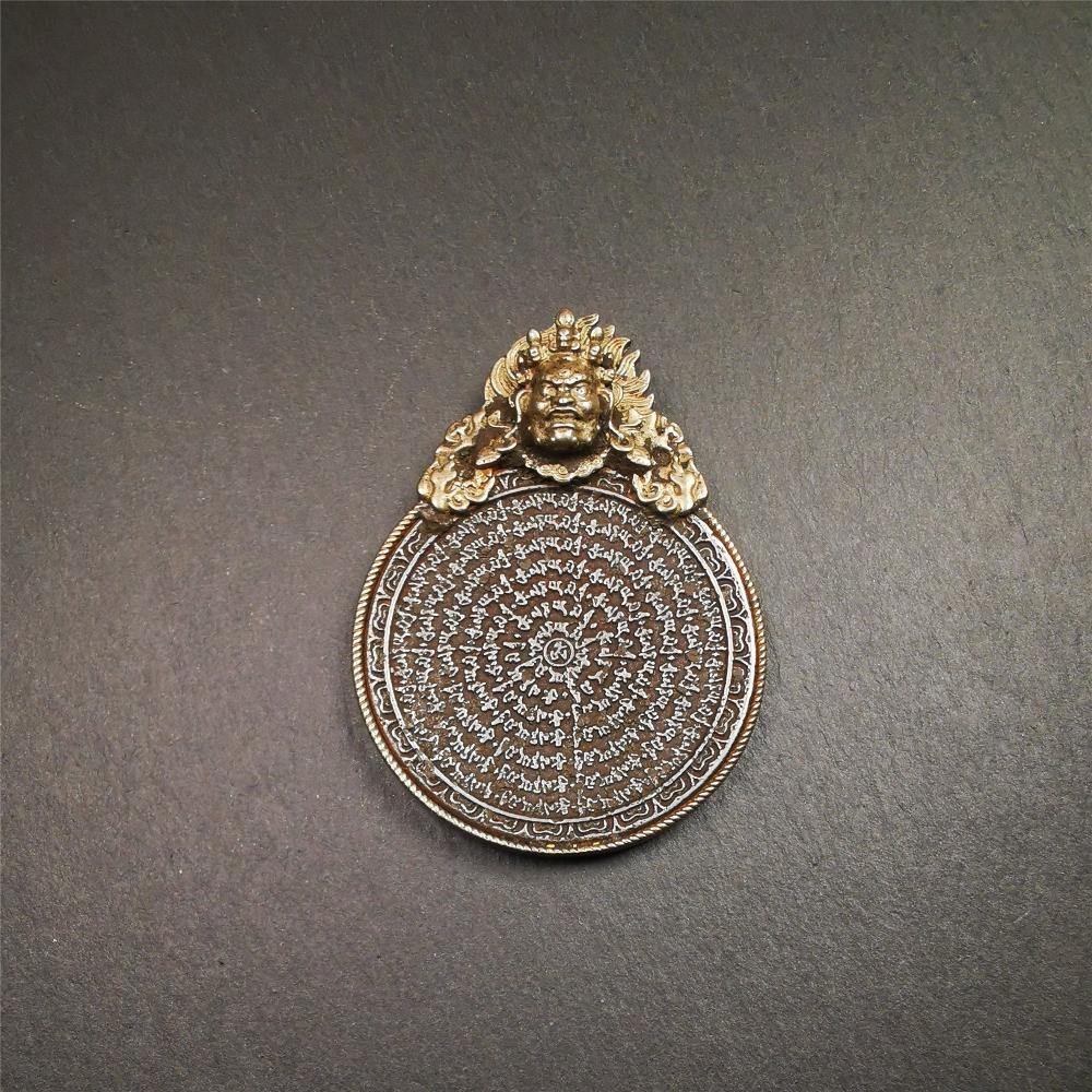 This type of tibetan mantra badge amulet was made by Tibetan craftsmen and come from Hepo Town, Baiyu County, Tibet.It is made of cold iron,grey color,carved mantra of Om Mani Padme Hum It adopts a split casting method, the shell is Mahakala.