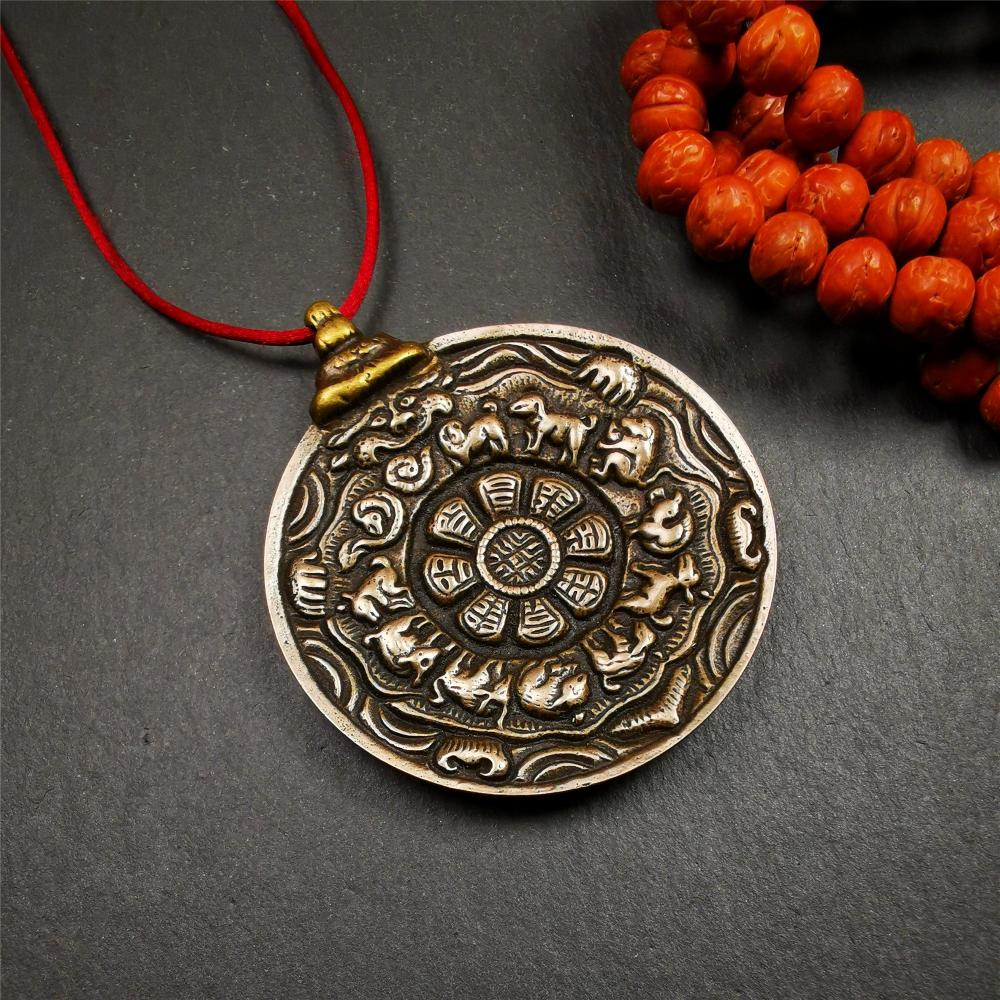 This melong calendar badge was collect from Kathok Monastery Tibet about 50+ years. This batch of melong are sacred amulets used by Kathok Monastery to present to believers,consecrated and blessed by lama. It adopts a split casting method,1.89 inch.