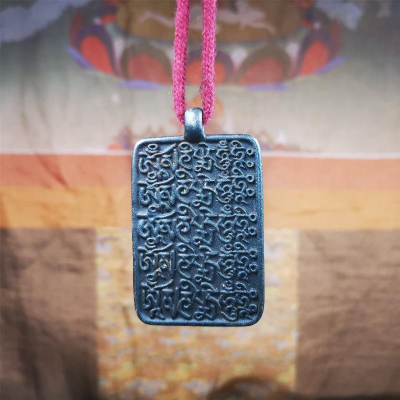 This badge is made by Tibetan craftsmen from Hepo Town, Baiyu County, the birthplace of the famous Tibetan handicrafts. It is made of copper, 2.52 × 1.57 inches. The front is the OM mantra and the back is body, speech, and mind.