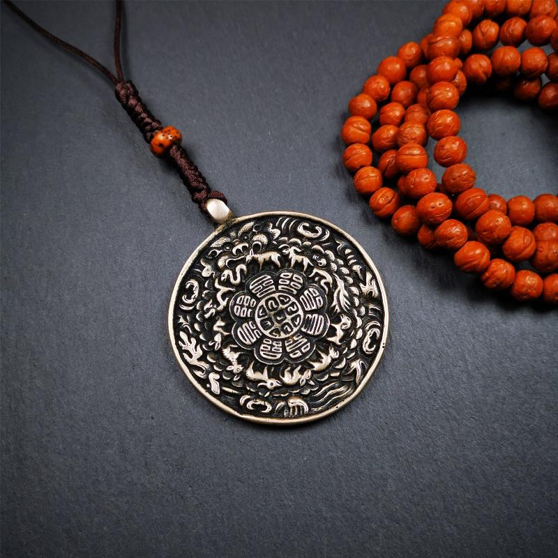 This type of melong amulet was made by Tibetan craftsmen and come from Hepo Town, Baiyu County, the birthplace of the famous Tibetan handicrafts,blessed by lama from Rejia Monastery,about 30 years old. It is made of lima brass,round shape,2.16 inches