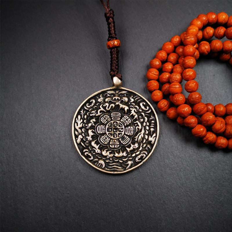 This type of melong amulet was made by Tibetan craftsmen and come from Hepo Town, Baiyu County, the birthplace of the famous Tibetan handicrafts,blessed by lama from Rejia Monastery,about 30 years old. It is made of lima brass,round shape,2.16 inches