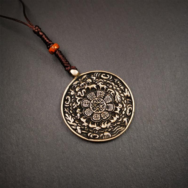 This type of melong amulet was made by Tibetan craftsmen and come from Hepo Town, Baiyu County, the birthplace of the famous Tibetan handicrafts,blessed by lama from Rejia Monastery,about 30 years old. It is made of lima brass,round shape,2.16 inches
