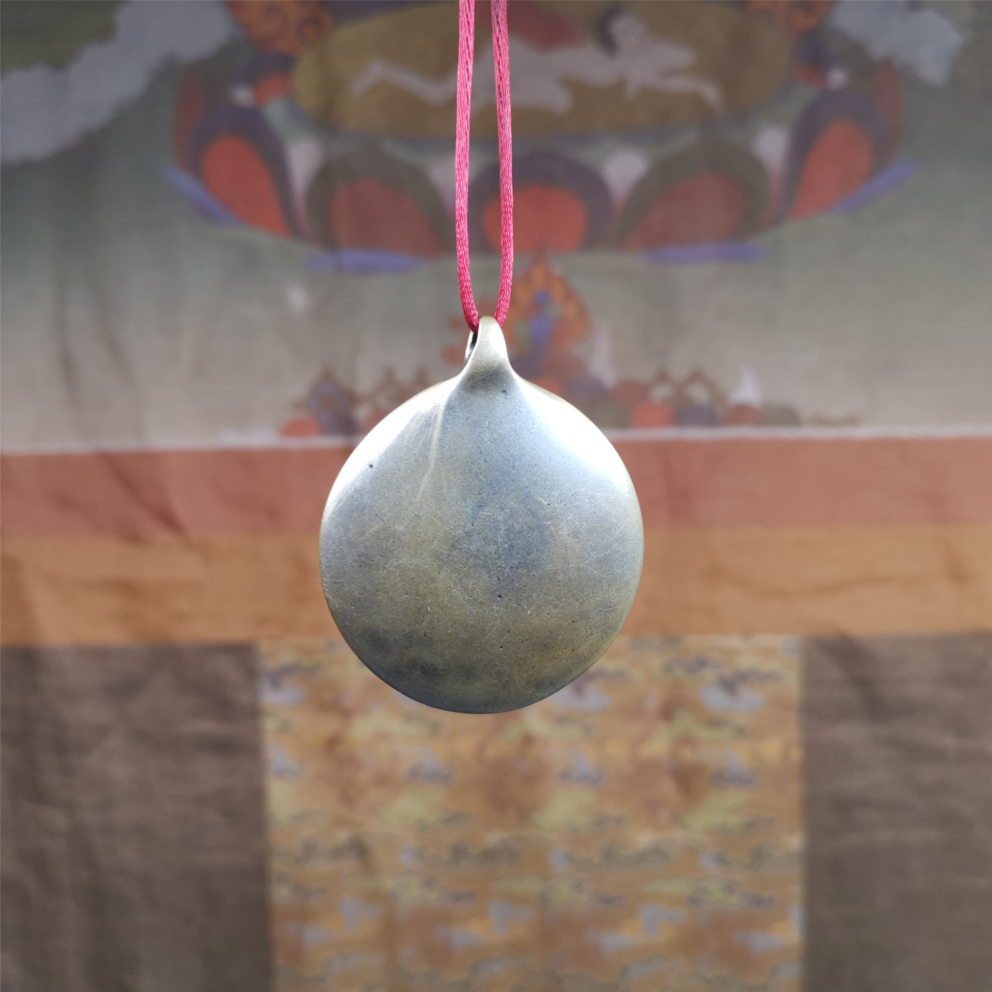 This Om badge amulet was collected from Yushu City Tibet,about 50 years old. It is round shape,made of lima brass, 1.58 inches,carved with mantra of chenrezig OM MANI PADME HUM. You can make it into a necklace, or a keychain, pendant