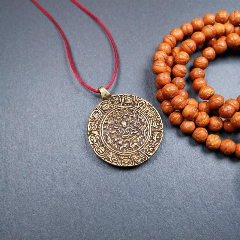 This Longevity Badge was handmade by Tibetan craftsmen and come from Hepo Town, Baiyu County, Tibet. It is made of brass,round shape,the theme is the god of longevity,surrounded by the symbols of Ashtamangala.