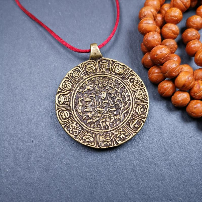 This Longevity Badge was handmade by Tibetan craftsmen and come from Hepo Town, Baiyu County, Tibet. It is made of brass,round shape,the theme is the god of longevity,surrounded by the symbols of Ashtamangala.