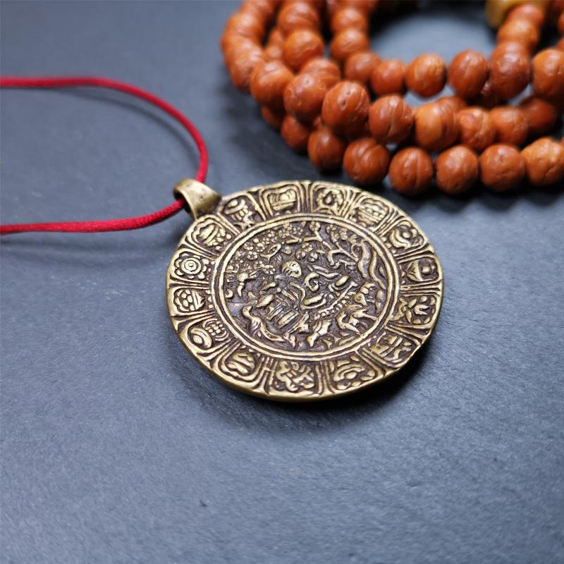 This Longevity Badge was handmade by Tibetan craftsmen and come from Hepo Town, Baiyu County, Tibet. It is made of brass,round shape,the theme is the god of longevity,surrounded by the symbols of Ashtamangala.