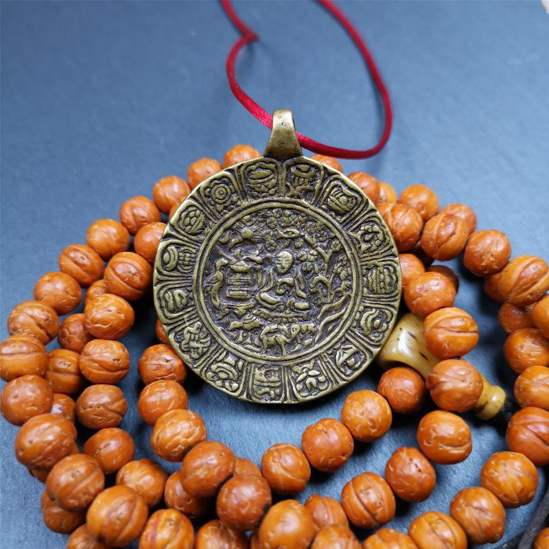 This Longevity Badge was handmade by Tibetan craftsmen and come from Hepo Town, Baiyu County, Tibet. It is made of brass,round shape,the theme is the god of longevity,surrounded by the symbols of Ashtamangala.