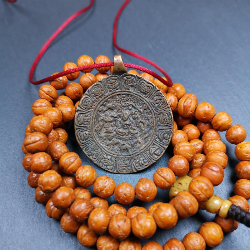 This old Longevity Badge was collected from Ganzi County Tibet about 100 years. It is made of copper,the theme is Shou-lao(the god of longevity) surrounded by the symbols of Ashtamangala. He is the ancient Chinese God of Longevity, represent Amitayus