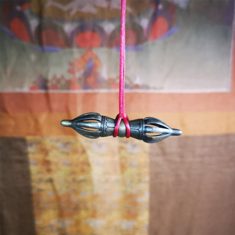 This unique vajra pendant was handmade by Tibetan craftsmen from Tibet in 1990s,from Hepo Town, Baiyu County, the birthplace of the famous Tibetan handicrafts. It is nine-pronged Vajra,made of copper, brown color,2.76 inches length.