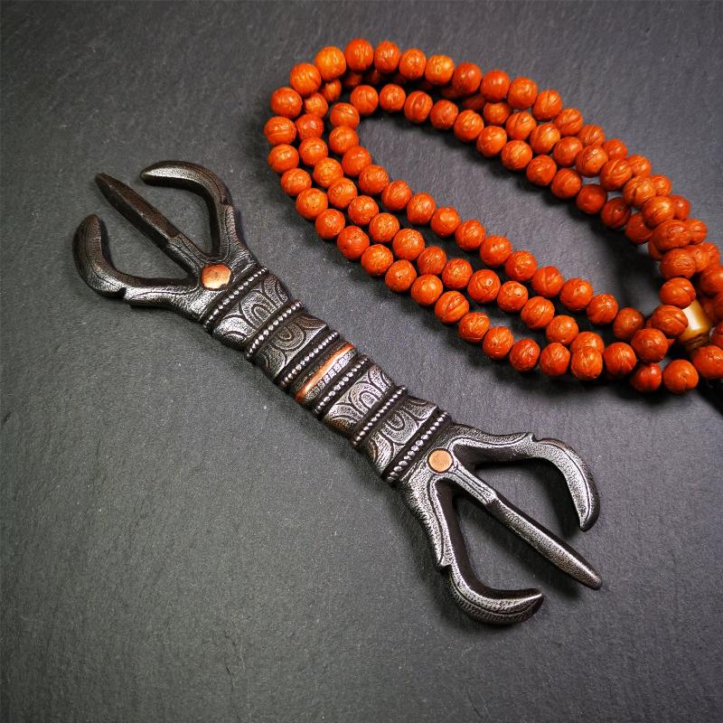 This unique vajra pendant was handmade by Tibetan craftsmen from Tibet in 1990s,from Hepo Town, Baiyu County, the birthplace of the famous Tibetan handicrafts. It is unique flat three - pronged Vajra,made of cold iron, black color,6.3 inches length.