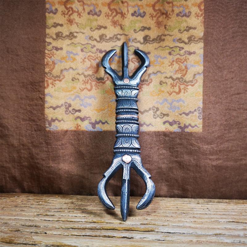 This unique vajra pendant was handmade by Tibetan craftsmen from Tibet in 1990s,from Hepo Town, Baiyu County, the birthplace of the famous Tibetan handicrafts. It is unique flat three - pronged Vajra,made of cold iron, black color,6.3 inches length.