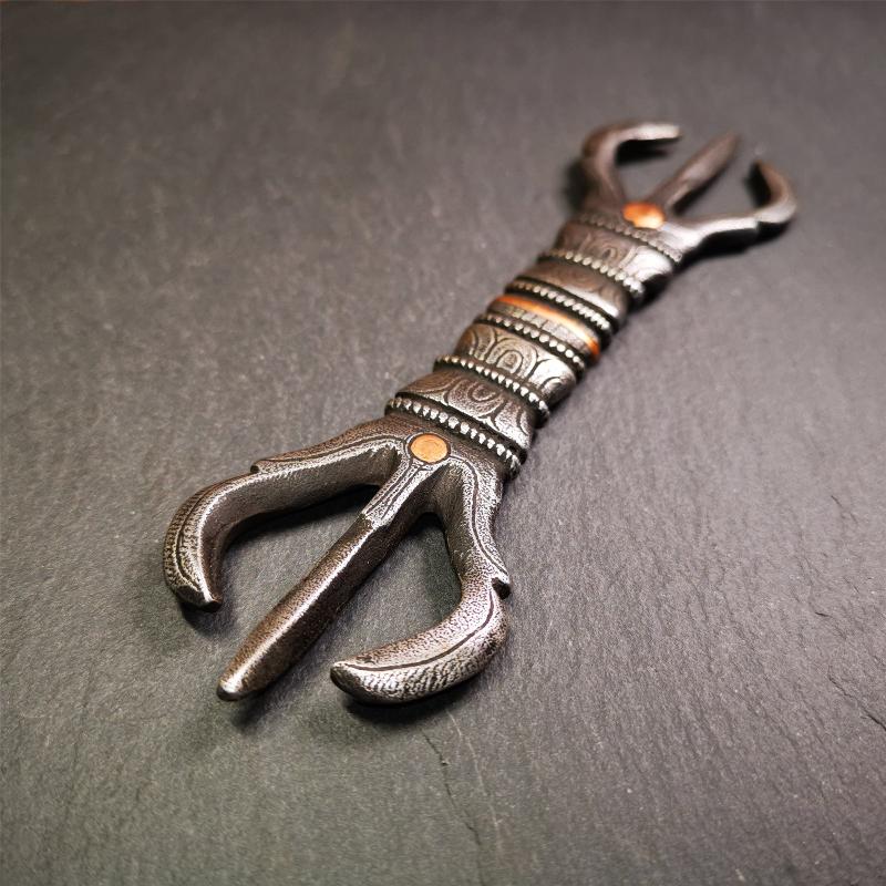 This unique vajra pendant was handmade by Tibetan craftsmen from Tibet in 1990s,from Hepo Town, Baiyu County, the birthplace of the famous Tibetan handicrafts. It is unique flat three - pronged Vajra,made of cold iron, black color,6.3 inches length.