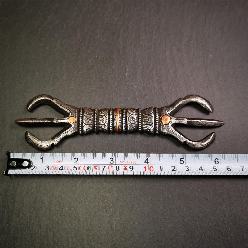 This unique vajra pendant was handmade by Tibetan craftsmen from Tibet in 1990s,from Hepo Town, Baiyu County, the birthplace of the famous Tibetan handicrafts. It is unique flat three - pronged Vajra,made of cold iron, black color,6.3 inches length.