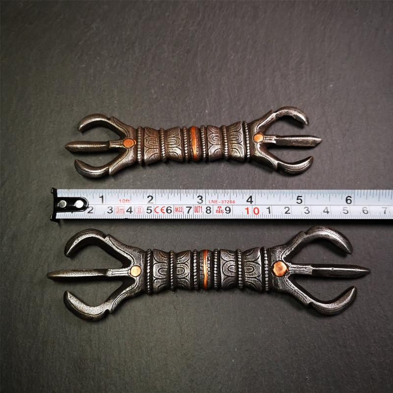 This unique vajra pendant was handmade by Tibetan craftsmen from Tibet in 1990s,from Hepo Town, Baiyu County, the birthplace of the famous Tibetan handicrafts. It is unique flat three - pronged Vajra,made of cold iron, black color,6.3 inches length.