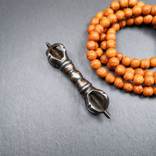 This unique vajra pendant was handmade by Tibetan craftsmen from Tibet in 1990s,from Hepo Town, Baiyu County, the birthplace of the famous Tibetan handicrafts. It is five - pronged Vajra,made of cold iron, black color,2.95 inches length.