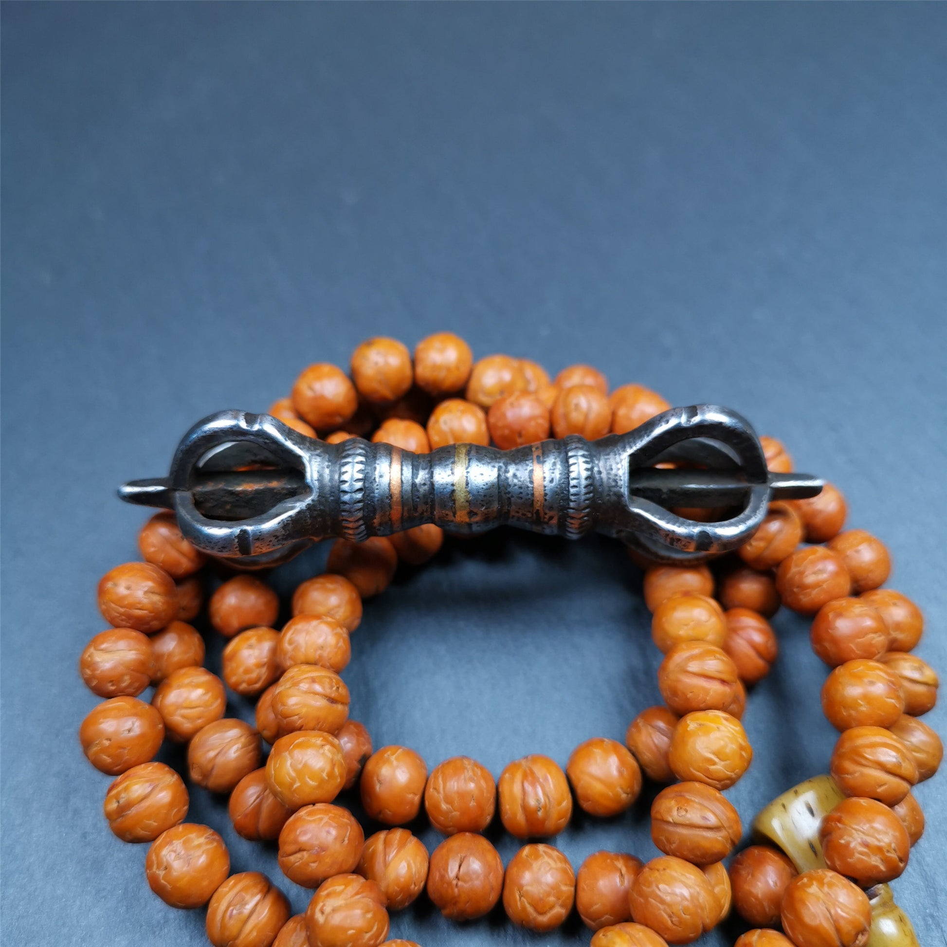 This unique vajra pendant was handmade by Tibetan craftsmen from Tibet in 1990s,from Hepo Town, Baiyu County, the birthplace of the famous Tibetan handicrafts. It is five - pronged Vajra,made of cold iron, black color,2.95 inches length.