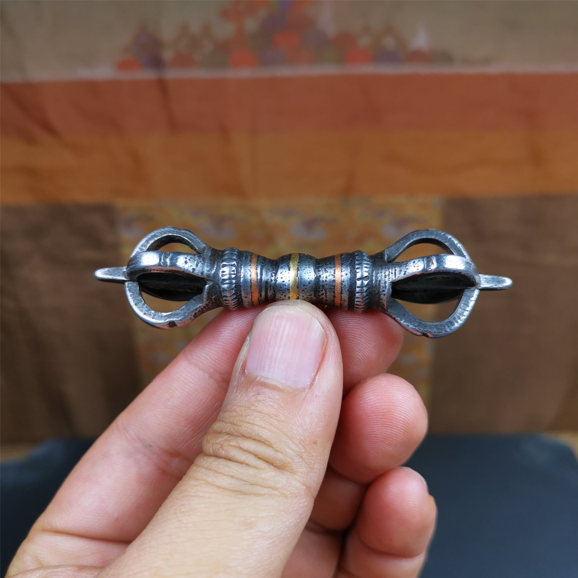This unique vajra pendant was handmade by Tibetan craftsmen from Tibet in 1990s,from Hepo Town, Baiyu County, the birthplace of the famous Tibetan handicrafts. It is five - pronged Vajra,made of cold iron, black color,2.95 inches length.