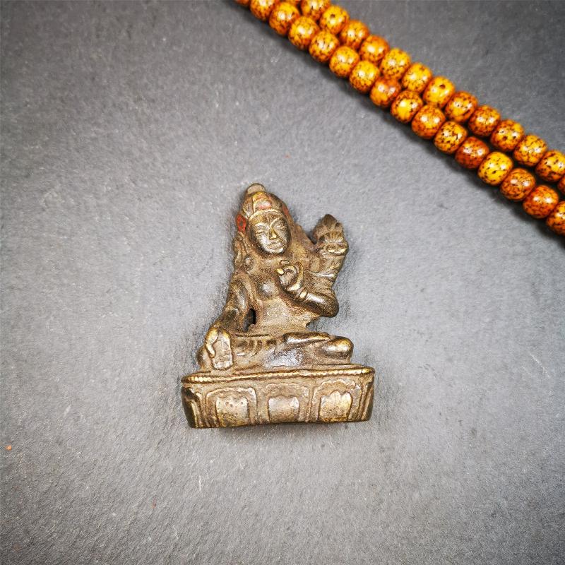 This green tara statue was collected from Samye Monastray, the first monastery in Tibet,and important Nyingma monsatery. It's an old-fashioned green tara statue,about 60 years old,made of copper and painted with mineral pigments. Green Tara is associated with enlightened activity and active compassion, and is the manifestation from which all her other forms emanate.