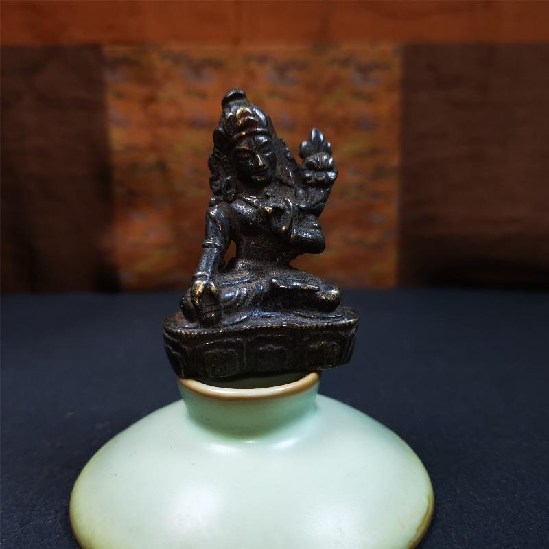 This green tara statue was collected from Samye Monastray, the first monastery in Tibet,and important Nyingma monsatery. It's an old-fashioned green tara statue,about 60 years old,made of copper and painted with mineral pigments. Green Tara is associated with enlightened activity and active compassion, and is the manifestation from which all her other forms emanate.