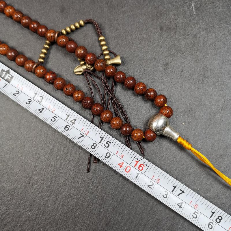 This old lotus seed mala was handmade from tibetan crafts man in Baiyu County,about 30 years old,blessed by lama. It's composed of 108 pcs 8mm lotus seed beads,then add some old agate,turquoise beads,1 pair of copper bead counters,and white copper guru bead on it.