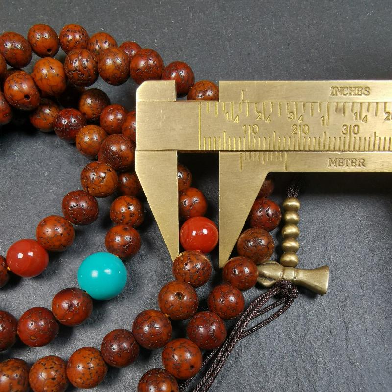 This old lotus seed mala was handmade from tibetan crafts man in Baiyu County,about 30 years old,blessed by lama. It's composed of 108 pcs 8mm lotus seed beads,then add some old agate,turquoise beads,1 pair of copper bead counters,and white copper guru bead on it.