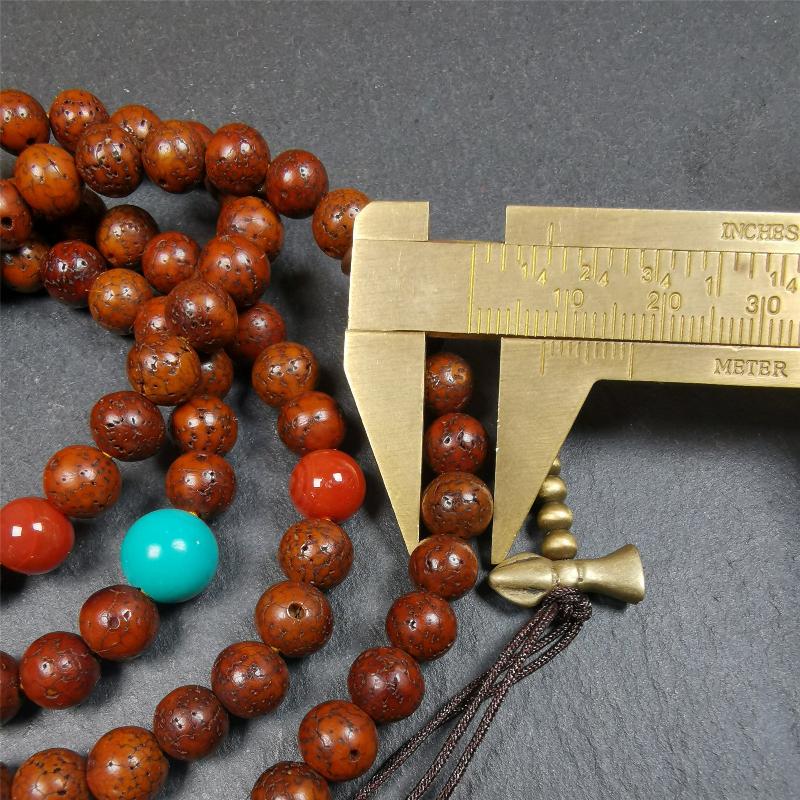 This old lotus seed mala was handmade from tibetan crafts man in Baiyu County,about 30 years old,blessed by lama. It's composed of 108 pcs 8mm lotus seed beads,then add some old agate,turquoise beads,1 pair of copper bead counters,and white copper guru bead on it.