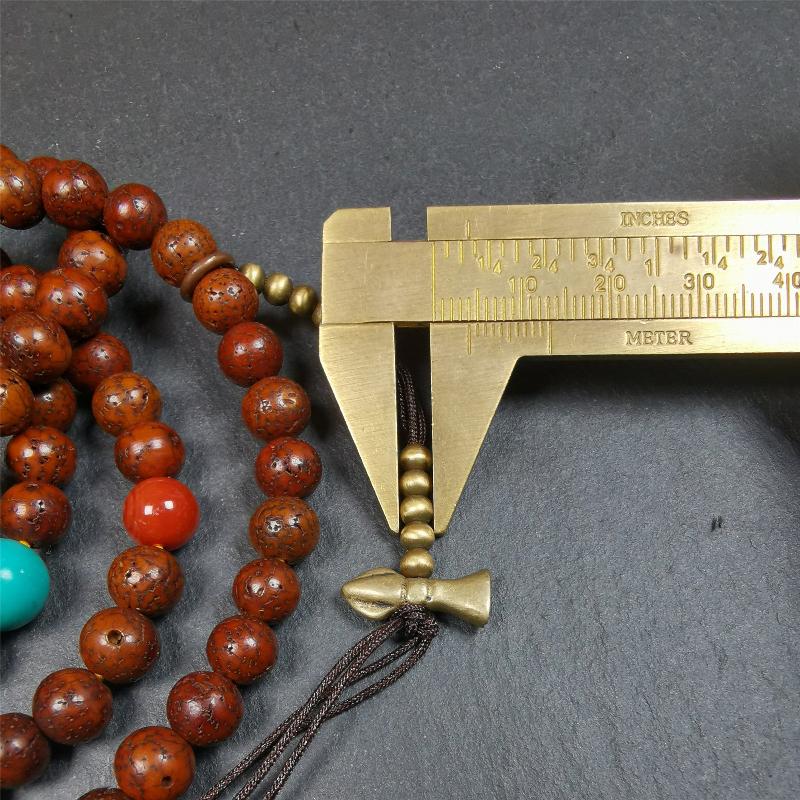 This old lotus seed mala was handmade from tibetan crafts man in Baiyu County,about 30 years old,blessed by lama. It's composed of 108 pcs 8mm lotus seed beads,then add some old agate,turquoise beads,1 pair of copper bead counters,and white copper guru bead on it.