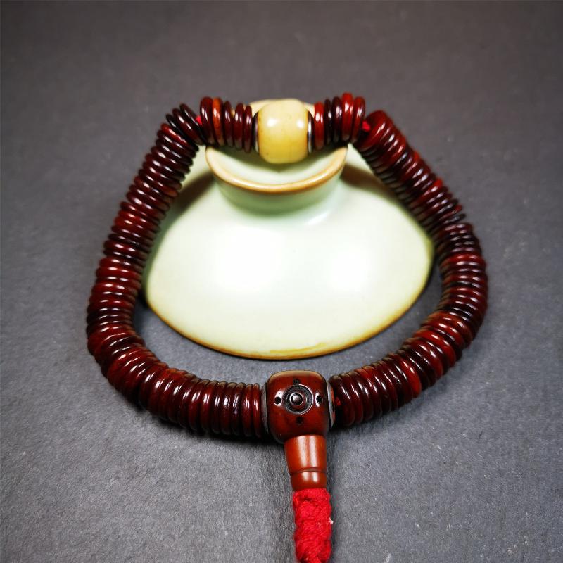 This bone carved mala beads is made by Tibetan craftsmen and come from Hepo Town, Baiyu County. It has 108 flat shape beads,1 spacer bead,and 1 guru bead,all hand carved with tibetan yak bone.