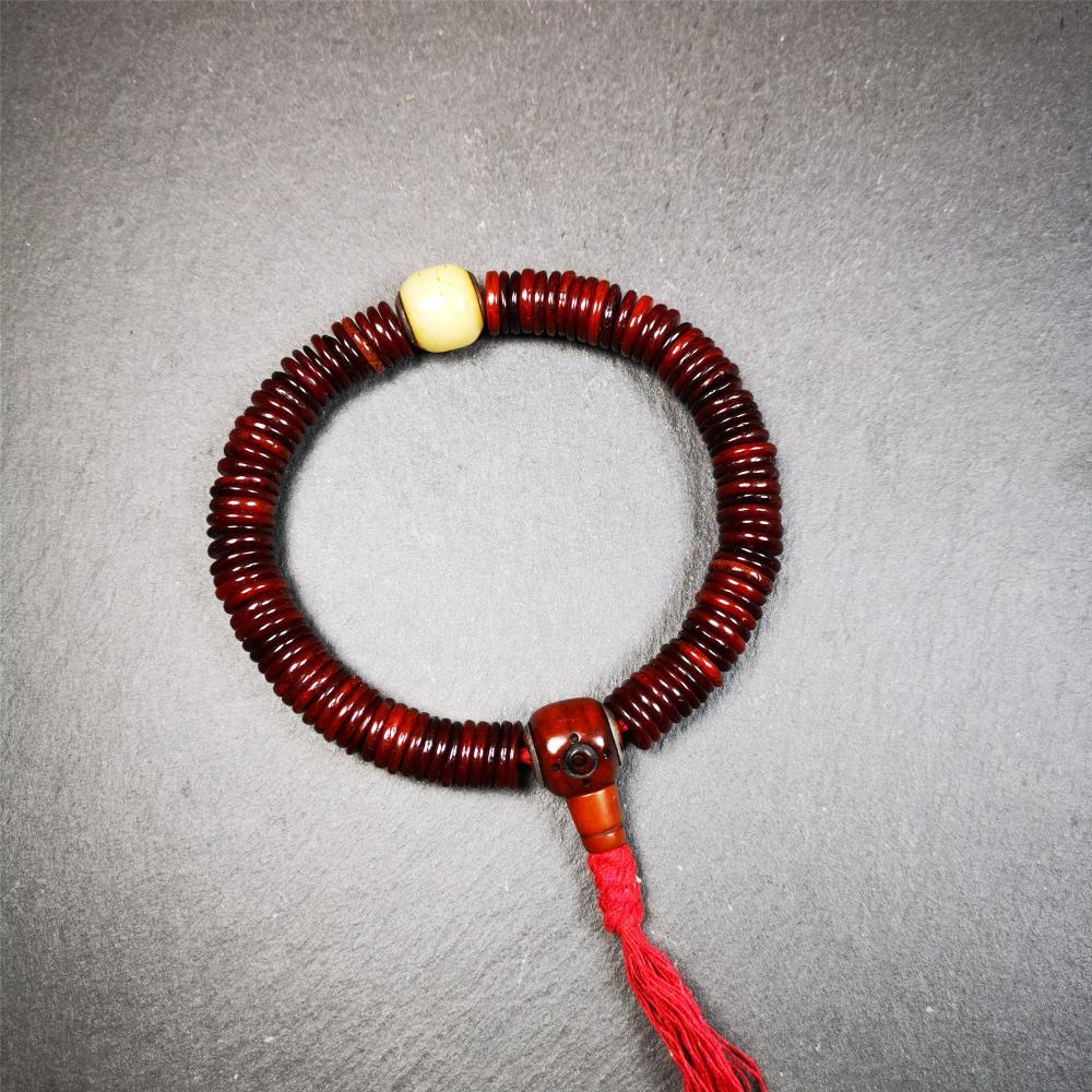 This bone carved mala beads is made by Tibetan craftsmen and come from Hepo Town, Baiyu County. It has 108 flat shape beads,1 spacer bead,and 1 guru bead,all hand carved with tibetan yak bone.