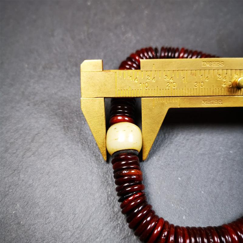 This bone carved mala beads is made by Tibetan craftsmen and come from Hepo Town, Baiyu County. It has 108 flat shape beads,1 spacer bead,and 1 guru bead,all hand carved with tibetan yak bone.
