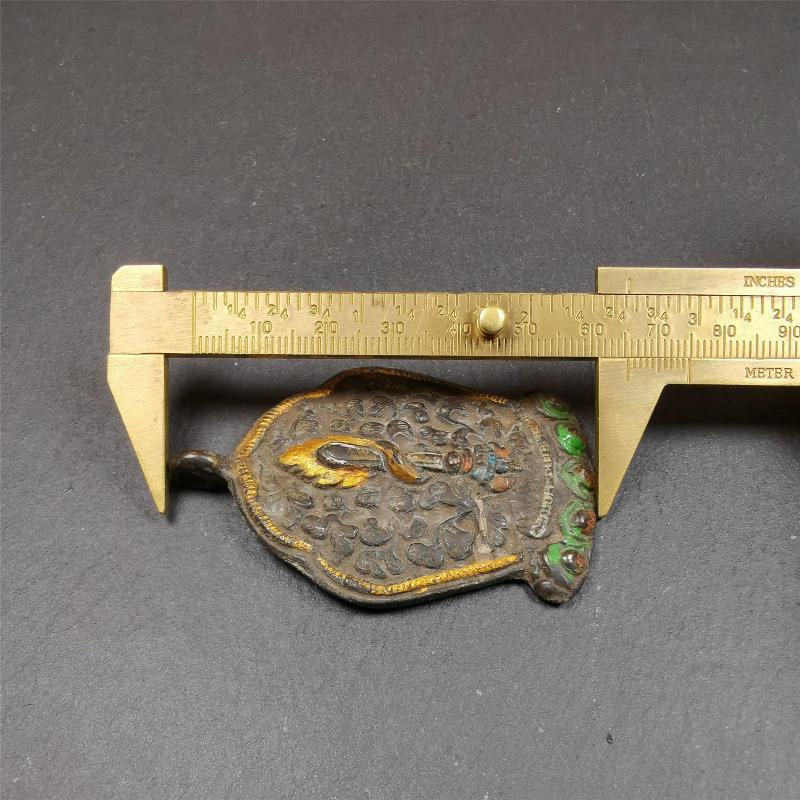 This Fire Sword amulet was collceted from gerze monastery, Tibet,about 30 years old. It's made of copper, a sword hangs on a lotus seat, surrounded by flames,painted mineral pigments. You can carry it as a necklace,or pendant,or put into your shrine.
