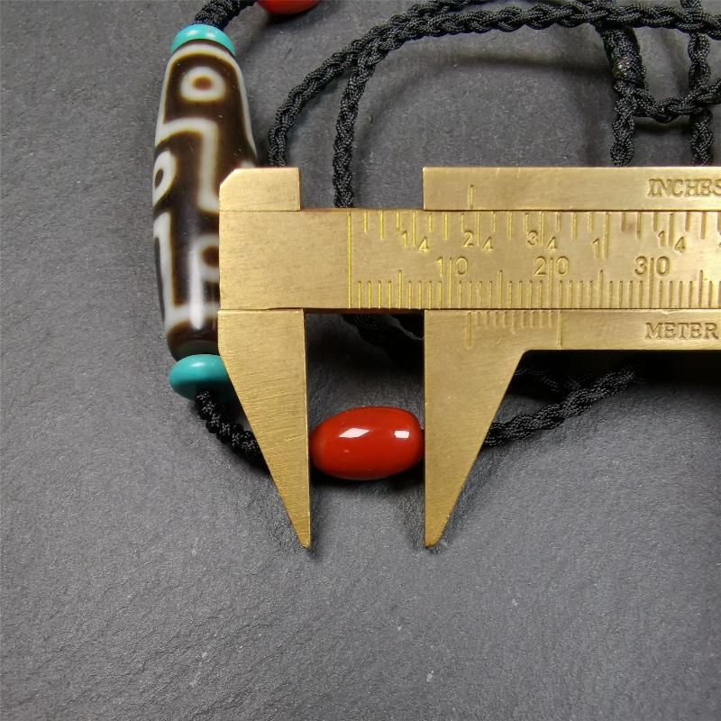 This 9 eyes dzi necklace was hand-woven by Tibetans from Baiyu County, the main bead is a 9 eyed  dzi bead, paired with 2 small agate beads and 2 turquoise spacer beads,about 30 years old.