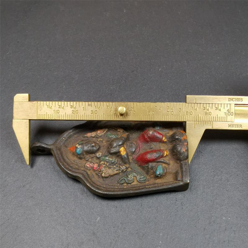 This maitreya statue was collected from Labrang Monastery,Qinghai,about 80 years old. It is an amulet of maitreya,made of copper,painted with mineral pigments,size is 2.95 by 1.97 inches,about 80 years old.