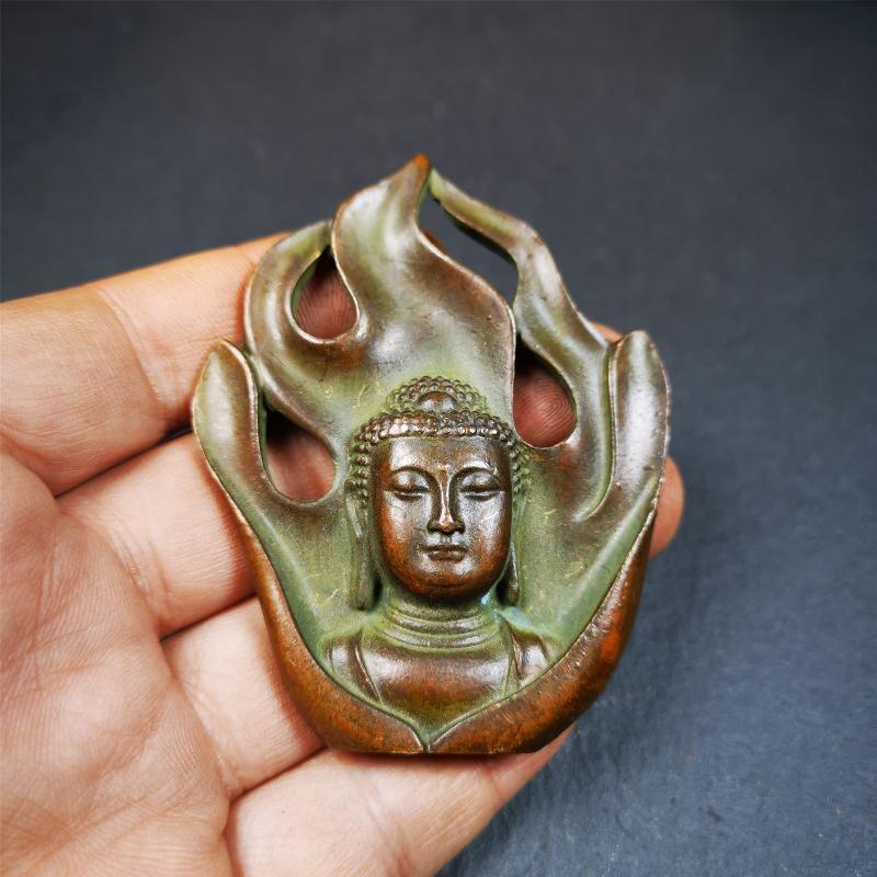 This shakyamuni statue was handmade from Baiyu Tibet. It is made of copper,the flame surrounds shakyamuni,the height is 2.9 inches,width is 1.85 inches.