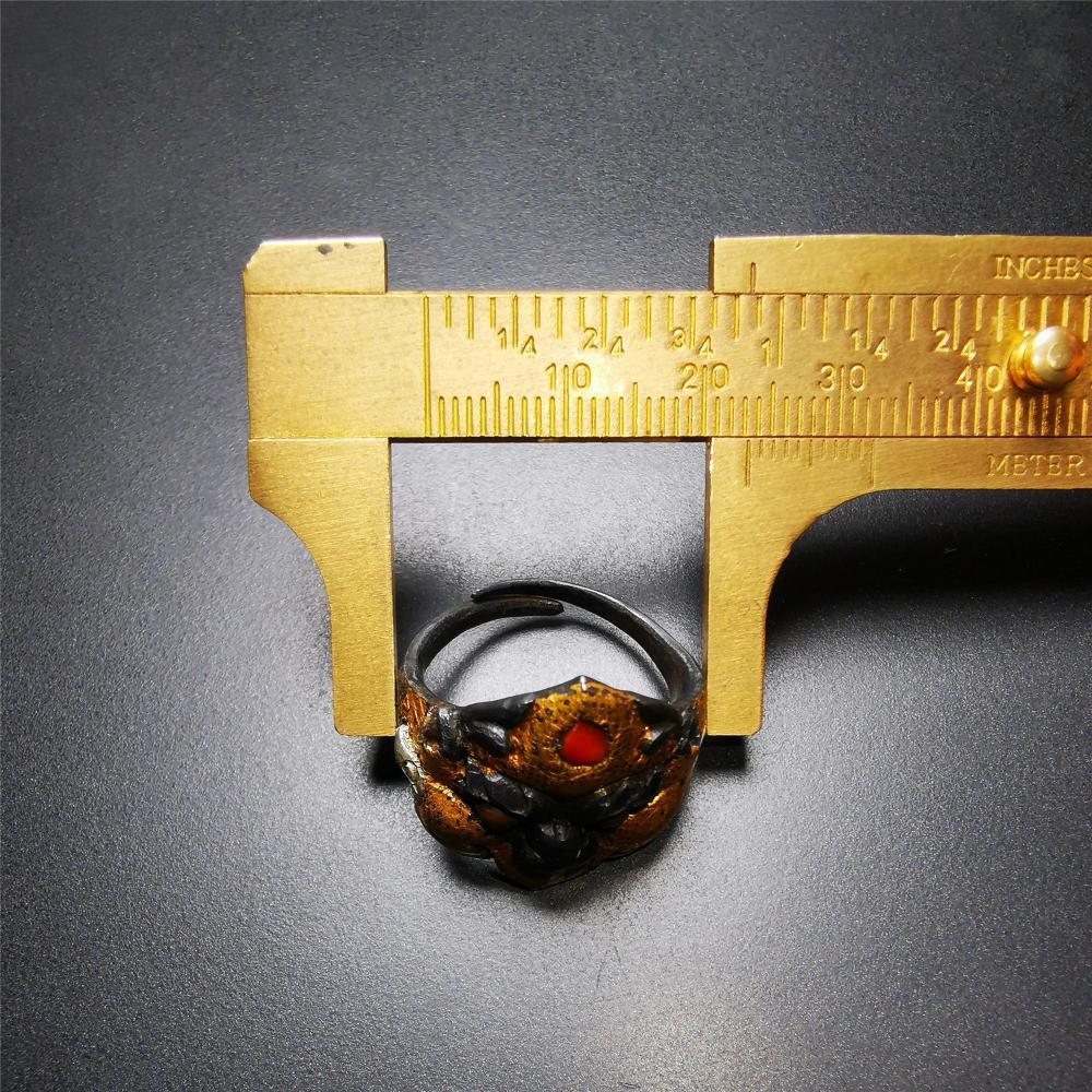 This garuda ring is made by Tibetan craftsmen for 30 years old,and come from Hepo Town, Baiyu County, the birthplace of the famous Tibetan handicrafts. It is crafted from a variety of materials including solid gold, sterling silver, cold iron, brass and agate,using traditional Tibetan craftsmanship to carry out multiple carvings and gold filled craftsmanship, inlaid with gold, silver, copper on the base of cold iron, together to create a classic image in Buddhism-Garuda-golden winged bird.