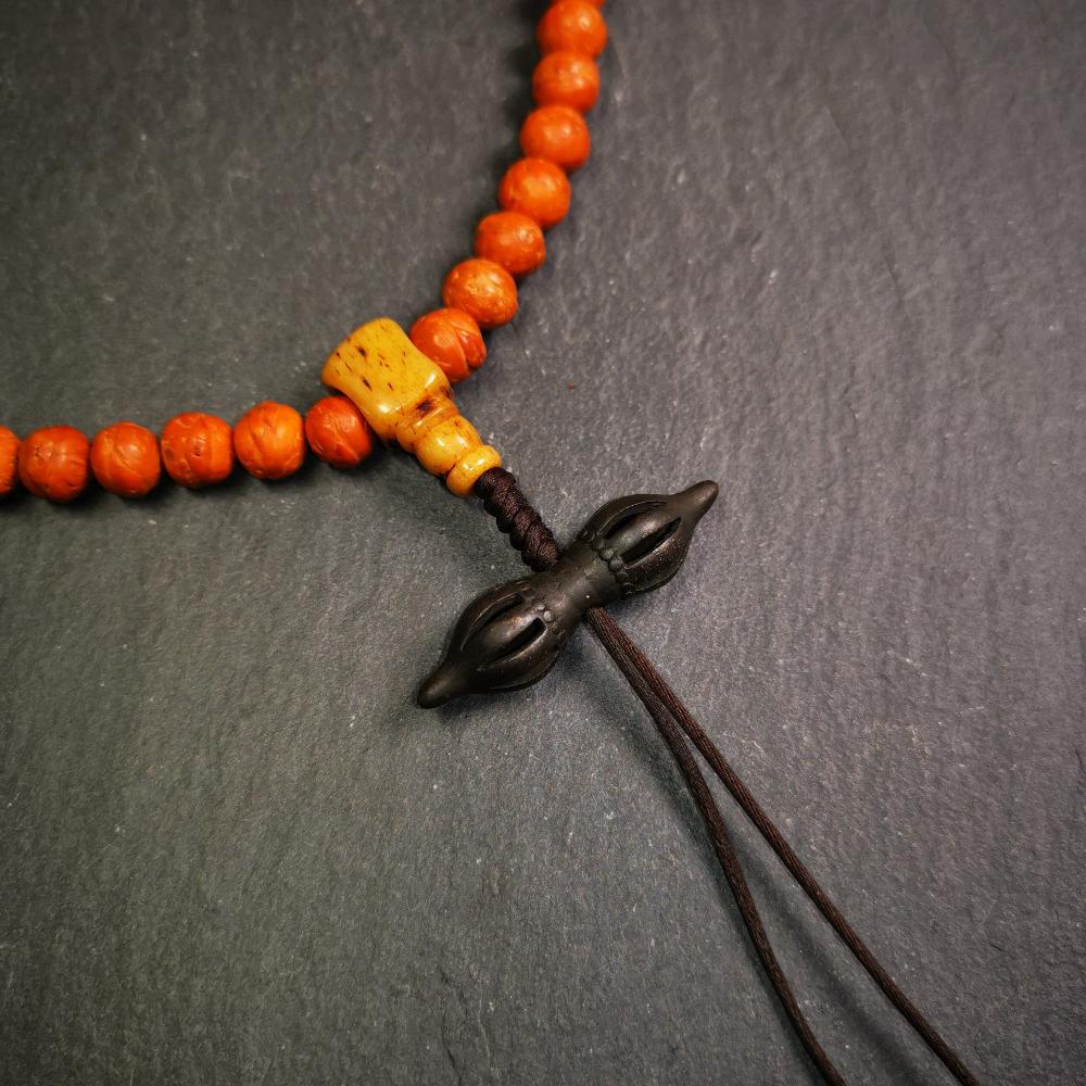 This vajra pendant was handmade by Tibetan craftsmen from Tibet,from Hepo Town, Baiyu County, the birthplace of the famous Tibetan handicrafts. It is nine-pronged vajra,made of brass,black color,1.5 inches length.