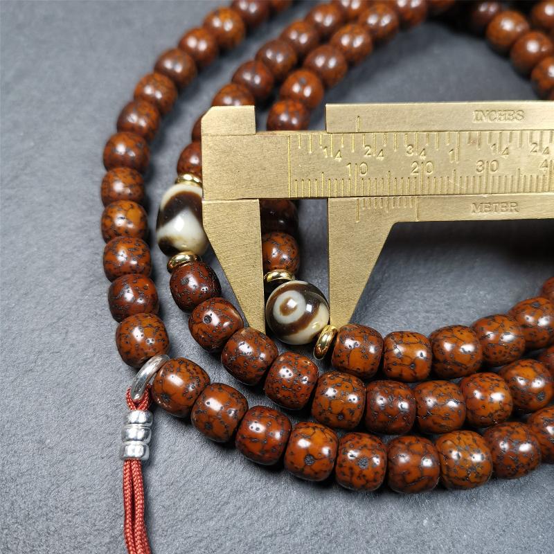 This old lotus seed mala was handmade from tibetan crafts man in Baiyu County,about 30 years old. It's composed of 108 lotus seed beads,then add some dzi beads,1 pair of silver bead counters,and ivory guru bead on i