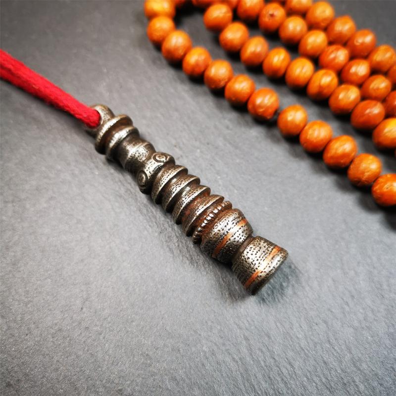 This beautiful stupa pendant is hand carved by Tibetan craftsmen from Tibet in 1990s. It was made of cold iron,inlaid copper dot,2.1 inches height,0.47 inch width. You can make it a pendant, or put it in your shrine.