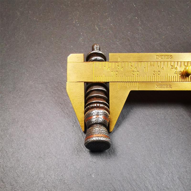 This beautiful stupa pendant is hand carved by Tibetan craftsmen from Tibet in 1990s. It was made of cold iron,inlaid copper dot,2.1 inches height,0.47 inch width. You can make it a pendant, or put it in your shrine.