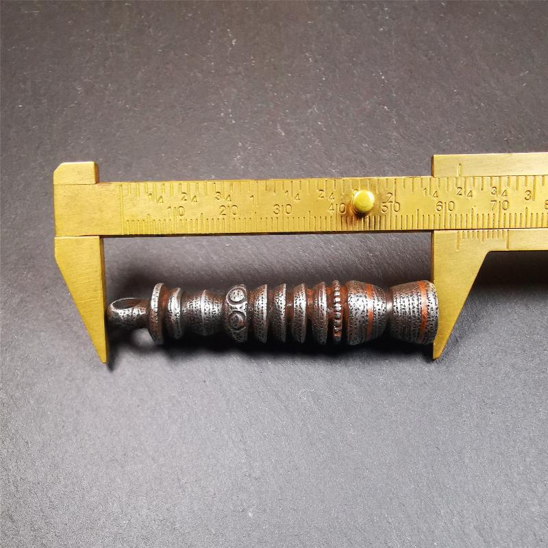 This beautiful stupa pendant is hand carved by Tibetan craftsmen from Tibet in 1990s. It was made of cold iron,inlaid copper dot,2.1 inches height,0.47 inch width. You can make it a pendant, or put it in your shrine.