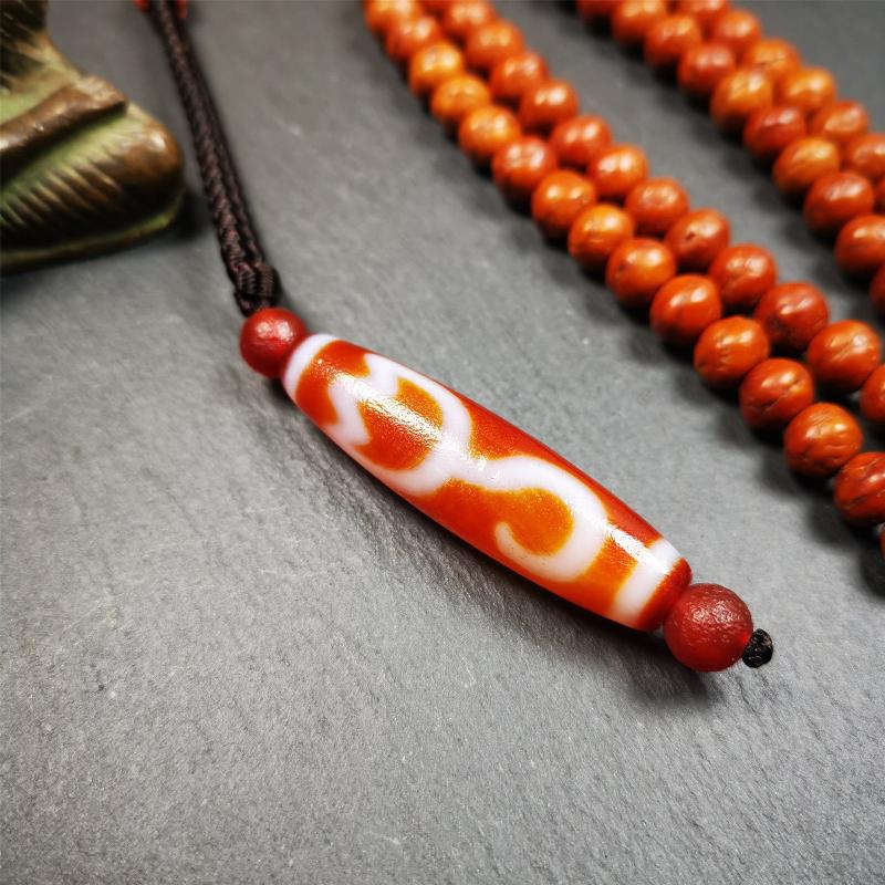 This vintage Lotus Dzi Bead is made of fire agate,new but high quality,size is 1.9" × 0.5". The lotus is the symbol of what is divine or immortal in humanity, and is also a symbol of divine perfection. The lotus is the attribute of sun and fire gods.