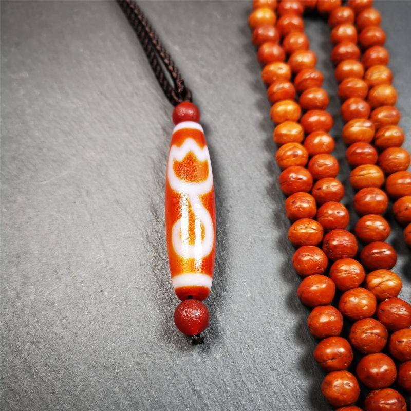 This vintage Lotus Dzi Bead is made of fire agate,new but high quality,size is 1.9" × 0.5". The lotus is the symbol of what is divine or immortal in humanity, and is also a symbol of divine perfection. The lotus is the attribute of sun and fire gods.
