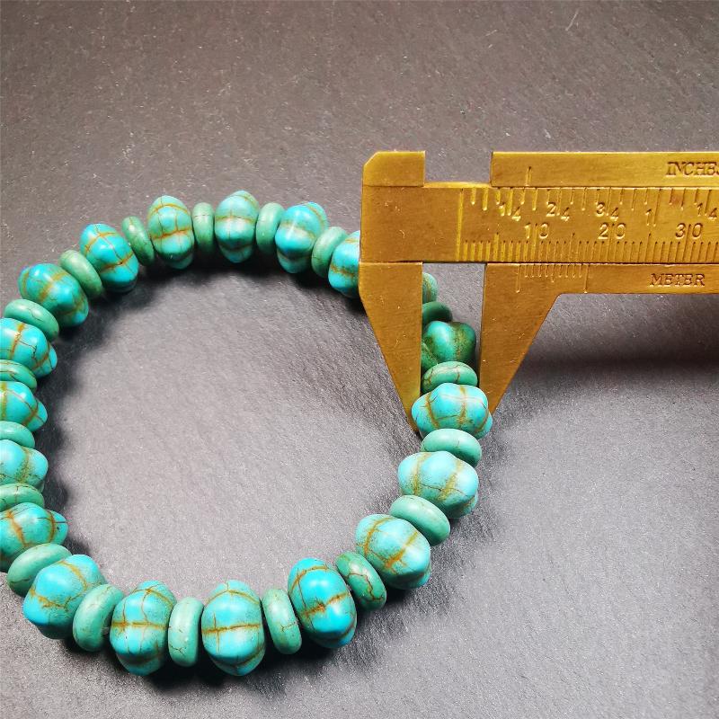This beautiful turquoise bracelet is handmade from Tibet in 1980's. It's green color, made of turquoise, 19 hexagon beads and 19 spacer beads in total,7.4 inches circumference,0.47 width.