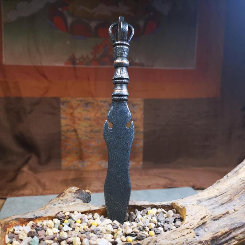 This phurba kila is handmade by Tibetan craftsmen from Tibet in 2000's,from Hepo Town, Baiyu County, the birthplace of the famous Tibetan handicrafts.  It's a kila dagger,made of cold iron, carved cloud pattern, inlaid red copper, and the half vajra on the handle,very delicate.