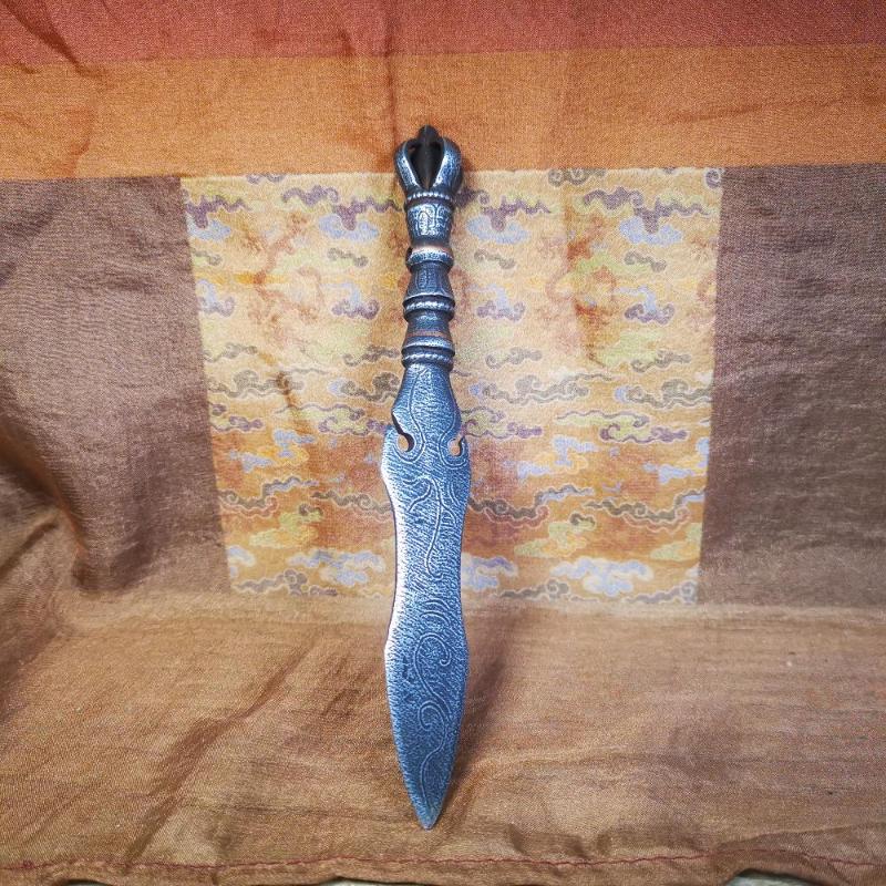 This phurba kila is handmade by Tibetan craftsmen from Tibet in 2000's,from Hepo Town, Baiyu County, the birthplace of the famous Tibetan handicrafts.  It's a kila dagger,made of cold iron, carved cloud pattern, inlaid red copper, and the half vajra on the handle,very delicate.