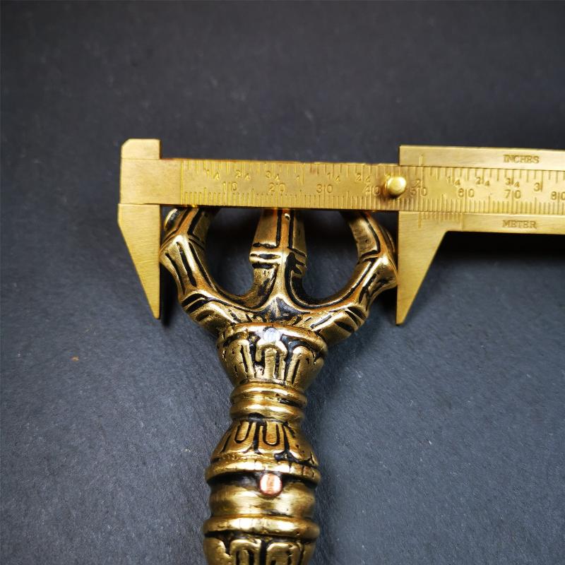 This unique vajra pendant was handmade by Tibetan craftsmen from Tibet in 2000's,from Hepo Town, Baiyu County, the birthplace of the famous Tibetan handicrafts. It is unique flat three - pronged Vajra,made of brass, yellow color,6.3 inches length. In tantric Buddhist practice, the vajra is a potent instrument with multifaceted meaning, symbolizing the adamantine state of existence of a Buddhist practitioner who has reached full enlightenment. The vajra is the archetypal symbol of tantric Buddhism.