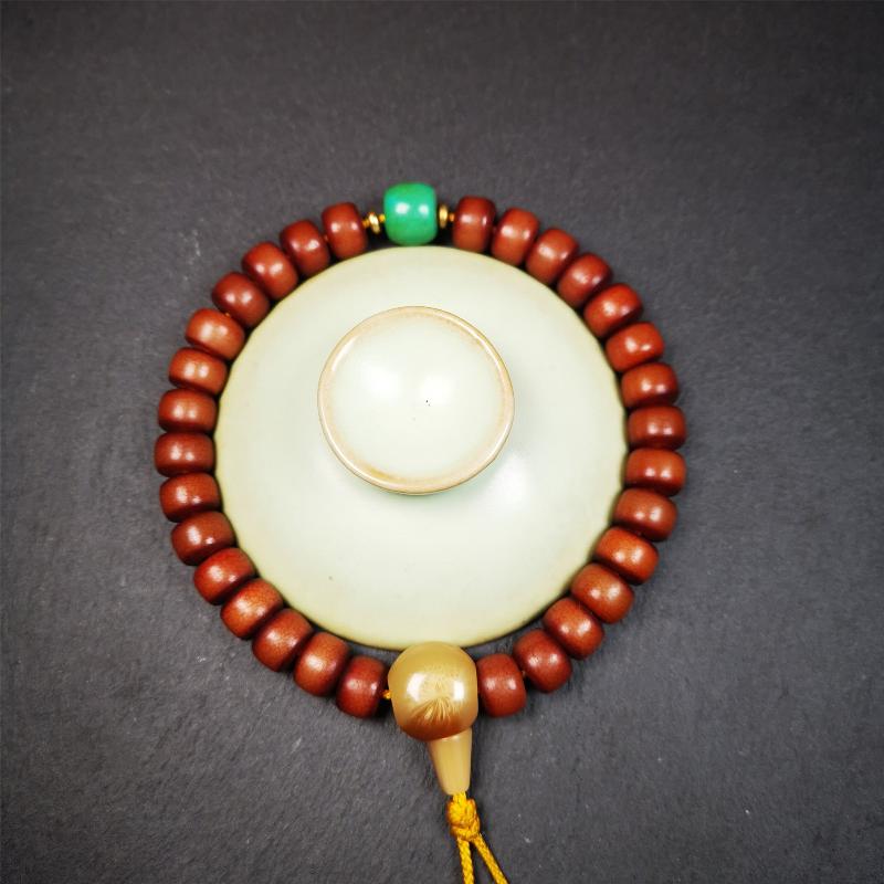 This bracelet mala was made by Tibetan craftsmen and come from Hepo Town, Baiyu County, the birthplace of the famous Tibetan handicrafts. It is made of Corypha Linn Seeds, diameter of 10mm / 0.4",circumference is 26cm / 10" ,with turquoise spacer bead, end of a yak horn guru bead.