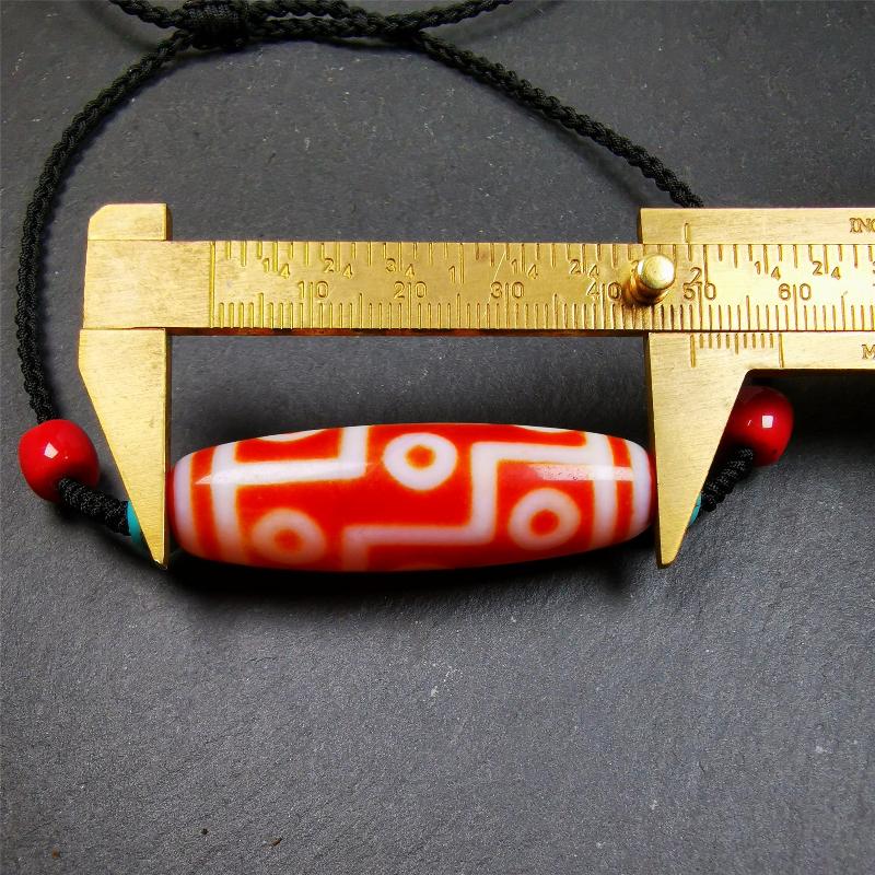 This necklace was hand-woven by Tibetans from Baiyu County, the main bead is a fire agate 9 eyes dzi, paired with 2 turquoise beads and 2 red agate beads,about 30 years old. The length of the necklace can be adjusted.